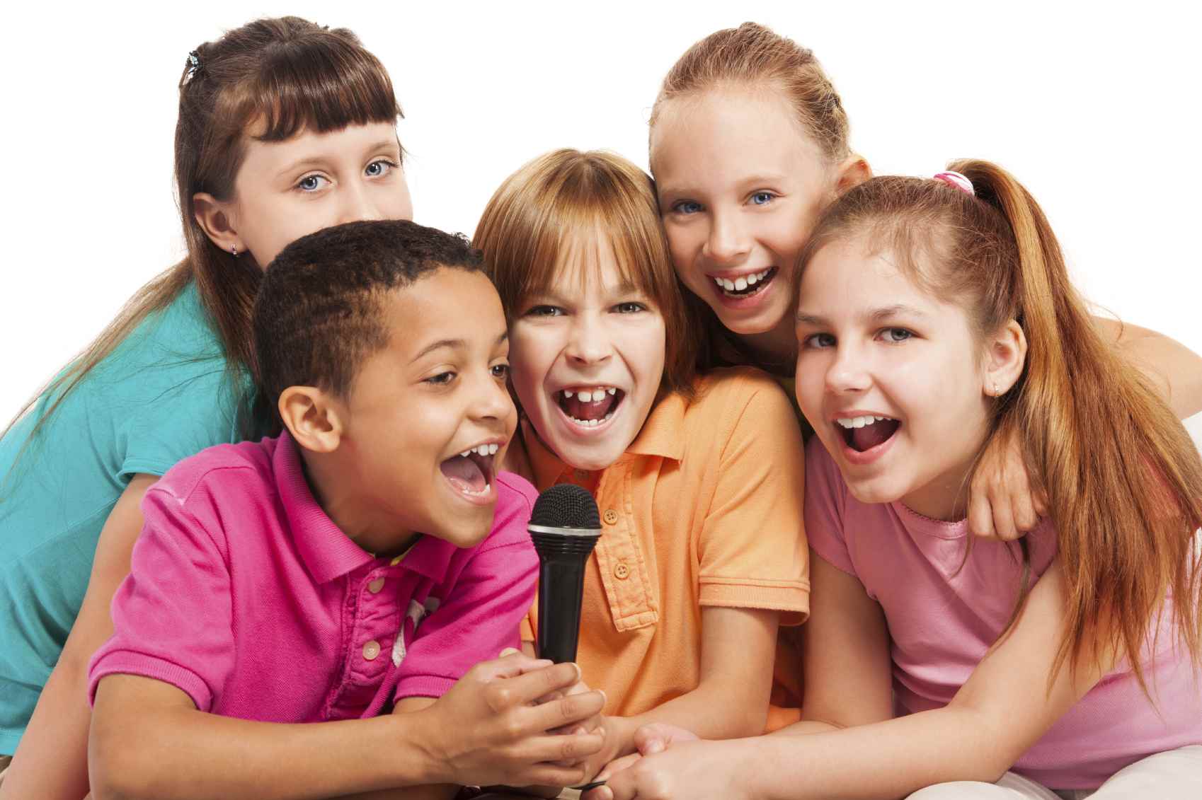  A group of diverse elementary school children singing and dancing to a song in a classroom.